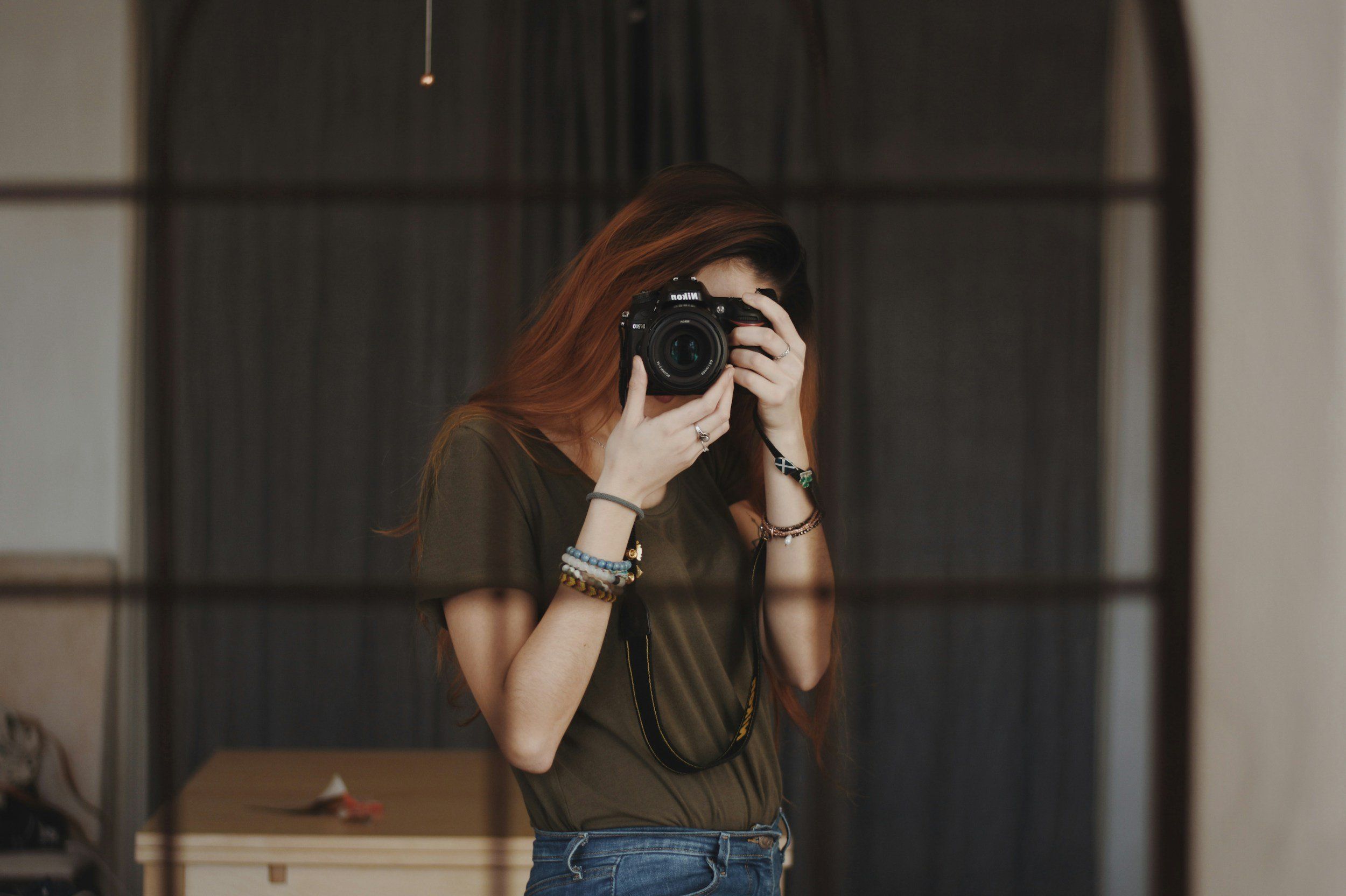 Woman taking a photo with a DSLR camera